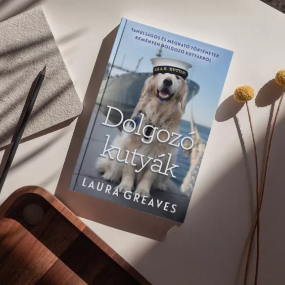 A képen a Dolgozó kutyák című könyv látható egy golden retriever kutyával a háttérben.