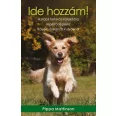 A képen az Ide hozzám című könyv látható a háttérben golden retrieverekkel.