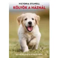 A képen a Kölyök a háznál című könyv látható a háttérben egy labrador.