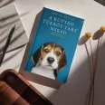 A képen A kutyád tükröt tart neked című könyv látható a háttérben egy beagle akit gazdája ölel.