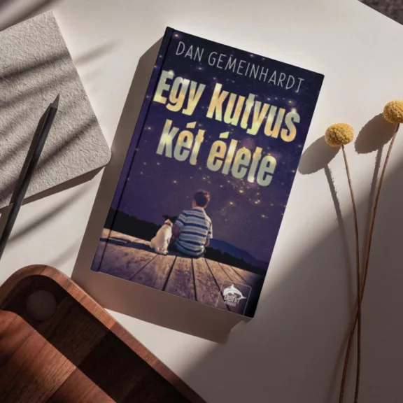 A képen az Egy kutyus két élete című könyv látható csillagos égbolt előtt.