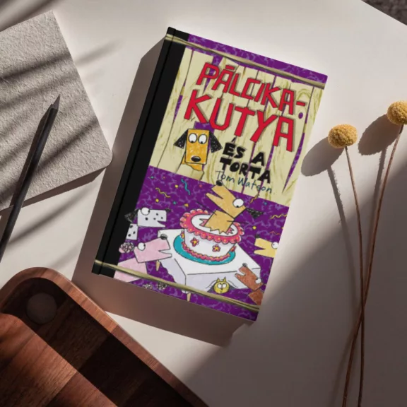 A képen a Pálcikakutya és a torta című könyv látható a háttérben tortával.