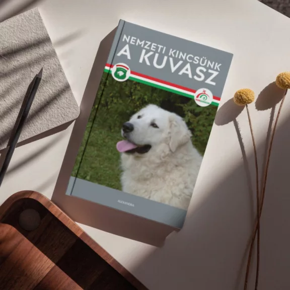 A képen a Nemzeti kincsünk a kuvasz című könyv látható a háttérben a magyar zászló színei.