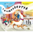 A képen A nyomozókutya című könyv látható a háttérben egy tacskó.