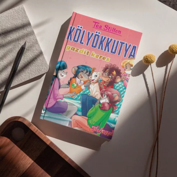 A képen a Kölyökkutya gazdit keres című könyv látható szivecskés háttér előtt.