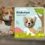 A képen az Ujjbábos lapozó Kiskutya című könyv látható a háttérben egy pitbull.