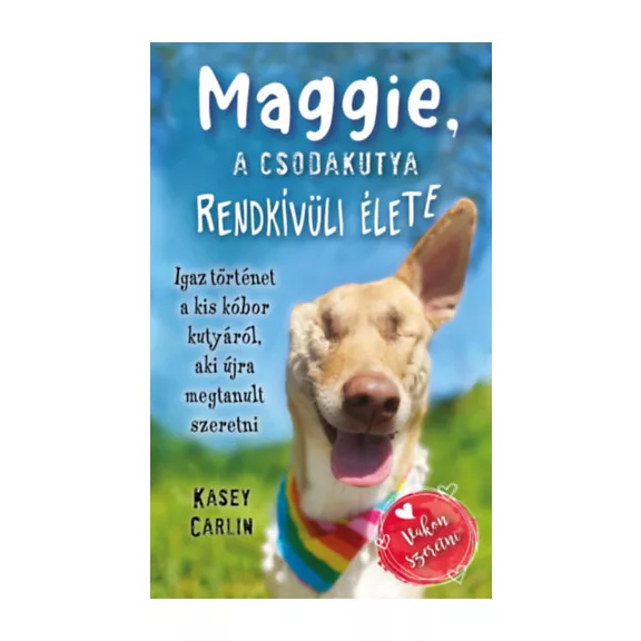 A képen a Maggie a csodakutya rendkívüli élete című könyv látható a háttérben egy réttel.