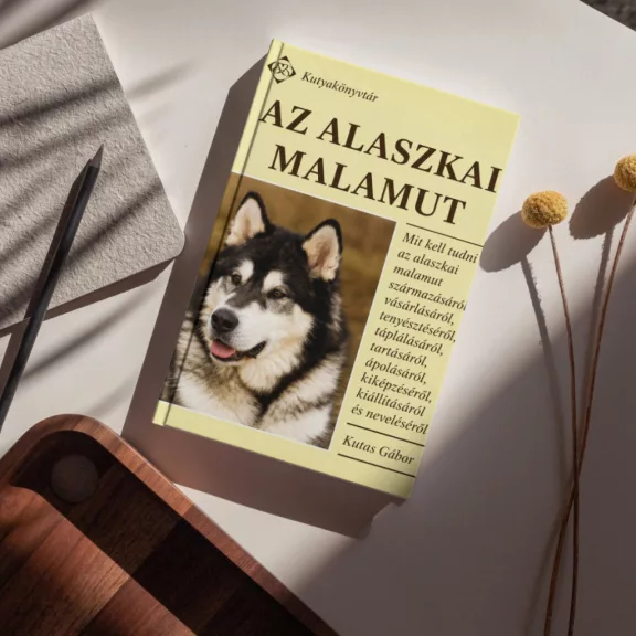 A képen Az alaszkai malamut című könyv látható kutyás témájú háttérrel.